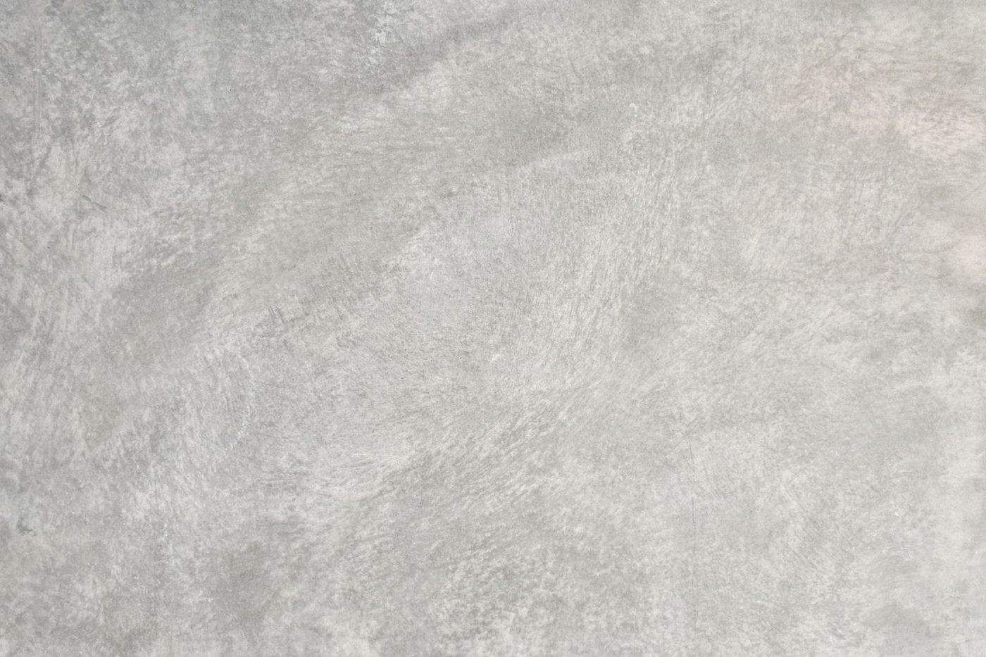 A concrete patio surface being floated to a smooth, even finish
